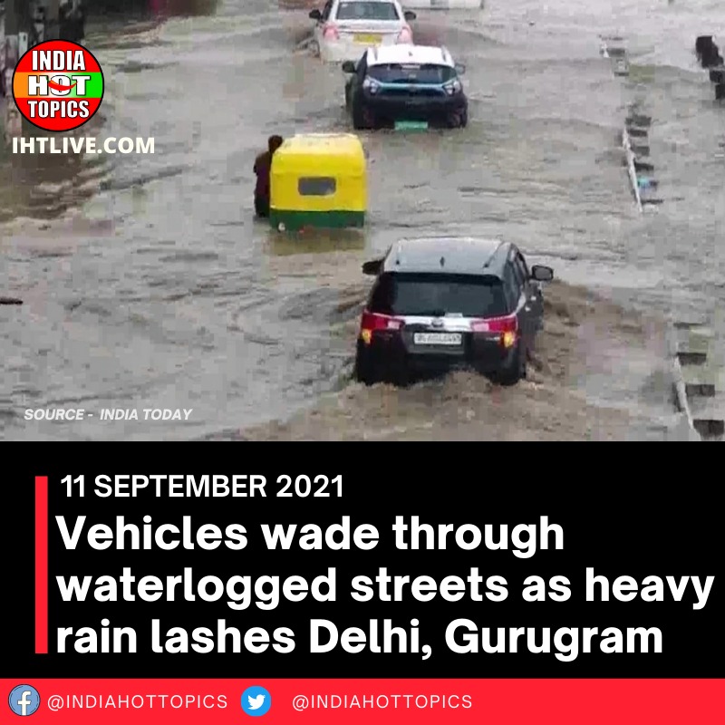 Vehicles wade through waterlogged streets as heavy rain lashes Delhi, Gurugram