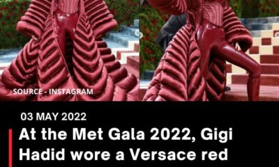 At the Met Gala 2022, Gigi Hadid wore a Versace red corset jumpsuit and a big cape jacket